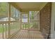 Screened in porch, providing an outdoor living space attached to a brick home at 1113 Urban Pl, Charlotte, NC 28209