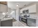 Stylish kitchen with stainless steel appliances, white cabinets, and granite countertops at 1153 Doris Ct, Rock Hill, SC 29730