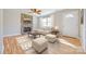 Inviting living room with a stone fireplace, light hardwood floors, and bright natural light at 1153 Doris Ct, Rock Hill, SC 29730