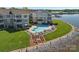 Aerial view showcasing the community pool and lake, enhancing the property's waterfront appeal at 1211 Torrence Cir, Davidson, NC 28036