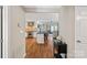 Open-concept living area with modern kitchen, hardwood floors, and lake views at 1211 Torrence Cir, Davidson, NC 28036