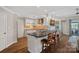 Well-equipped kitchen with island, stainless steel appliances, and stylish backsplash at 1211 Torrence Cir, Davidson, NC 28036