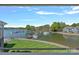Beautiful lake view featuring a marina, docks, boat slips, and well-manicured grassy lawn at 1211 Torrence Cir, Davidson, NC 28036