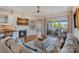 Cozy living room features a fireplace, built-in shelving, and access to a private balcony at 1211 Torrence Cir, Davidson, NC 28036
