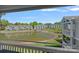 Scenic water view of pond reflecting multiple blue and grey residential buildings with manicured lawns at 1211 Torrence Cir, Davidson, NC 28036