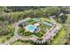 Aerial shot showcasing community amenities including tennis courts, swimming pools, and a playground at 13813 Jacks Ln, Pineville, NC 28134