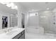 Bathroom with double shower heads and soaker tub at 13813 Jacks Ln, Pineville, NC 28134