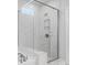 Glass shower featuring marble walls and tiled niche at 13813 Jacks Ln, Pineville, NC 28134
