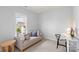 A comfortable bedroom featuring a work area, chair, and window view at 13813 Jacks Ln, Pineville, NC 28134
