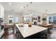 Modern kitchen with a large island, stainless steel sink, and pendant lights at 13813 Jacks Ln, Pineville, NC 28134