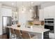 Modern kitchen features a center island with barstool seating, stainless steel appliances, and pendant lighting at 13813 Jacks Ln, Pineville, NC 28134