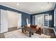 Relaxing living area with a leather couch, a decorative mirror, and stylish rug at 13813 Jacks Ln, Pineville, NC 28134