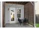 Outdoor patio with string lights, privacy screen and dining set at 13813 Jacks Ln, Pineville, NC 28134
