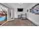 Entertainment area boasts a modern bar, sports memorabilia, and walkout access to the outdoor pool at 140 Wandering Ln, Bessemer City, NC 28016