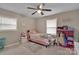 This bedroom features a ceiling fan, window, and a comfy pink bed at 140 Wandering Ln, Bessemer City, NC 28016