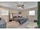 This bedroom features a bed, ceiling fan, and a large mirror at 140 Wandering Ln, Bessemer City, NC 28016
