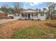 Charming single-story home with a covered front porch and black shutters at 140 Wandering Ln, Bessemer City, NC 28016