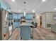 Modern kitchen with an island, stainless steel appliances and light blue cabinetry at 140 Wandering Ln, Bessemer City, NC 28016