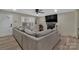 Cozy living room features a brick fireplace, a ceiling fan, and plenty of natural light at 140 Wandering Ln, Bessemer City, NC 28016