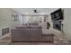 Spacious living room with an electric fireplace and a large sectional sofa at 140 Wandering Ln, Bessemer City, NC 28016
