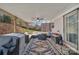 This outdoor patio features comfortable seating, a ceiling fan, and a grill at 140 Wandering Ln, Bessemer City, NC 28016