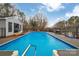 Full backyard pool, with an enclosed entertainment area and outdoor storage, surrounded by a fence at 140 Wandering Ln, Bessemer City, NC 28016