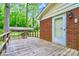 Wood deck with brick wall that leads to a spacious backyard, perfect for outdoor relaxation at 1409 Sherwood Dr, Kannapolis, NC 28081