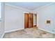 Clean bedroom offers a neutral backdrop with carpet flooring, providing a serene and customizable space at 1409 Sherwood Dr, Kannapolis, NC 28081
