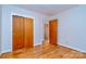 Bedroom with hardwood floors and closet offers a cozy and classic design at 1409 Sherwood Dr, Kannapolis, NC 28081