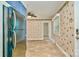 Spacious kitchen includes a stainless steel refrigerator, tiled floor, and floral wallpaper, creating a unique space at 1409 Sherwood Dr, Kannapolis, NC 28081