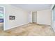 Cozy living room with neutral walls, plush carpet, and ample natural light, a perfect relaxation space at 1409 Sherwood Dr, Kannapolis, NC 28081