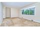 Bright living room with large window and carpet flooring, ready for comfortable living and relaxation at 1409 Sherwood Dr, Kannapolis, NC 28081