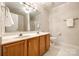 Bathroom with double vanity, tiled floors, and modern lighting at 1581 Arborgate Dr, Rock Hill, SC 29732