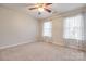 Inviting bedroom with natural light from two windows and a ceiling fan for added comfort at 1581 Arborgate Dr, Rock Hill, SC 29732