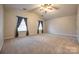 Spacious main bedroom with vaulted ceiling, carpeted floor and natural light from two windows at 1581 Arborgate Dr, Rock Hill, SC 29732