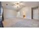 Bright main bedroom with vaulted ceiling, ceiling fan, and en suite bathroom at 1581 Arborgate Dr, Rock Hill, SC 29732