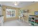 Bright bedroom with natural light, sewing station, and ample storage shelves at 16524 Kettlewell Ln, Charlotte, NC 28277