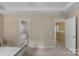 Bedroom with an ensuite bathroom and a view of the hallway at 16524 Kettlewell Ln, Charlotte, NC 28277