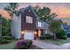 Inviting home with brick accents, a well-kept lawn, and an attached two-car garage at 16524 Kettlewell Ln, Charlotte, NC 28277