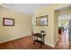 Elegant foyer with hardwood floors, decorative mirror, and view into kitchen and staircase at 16524 Kettlewell Ln, Charlotte, NC 28277