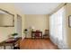 Cozy home office featuring hardwood floors, ample natural light, and classic furniture at 16524 Kettlewell Ln, Charlotte, NC 28277