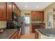 Well-maintained kitchen with stainless steel appliances and spacious countertops with eat in bar at 16524 Kettlewell Ln, Charlotte, NC 28277