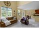 Inviting living space with ample natural light, complemented by a dining area for seamless entertaining at 16524 Kettlewell Ln, Charlotte, NC 28277