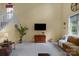 Bright living room with neutral carpet, large windows, and a comfortable seating area for relaxation at 16524 Kettlewell Ln, Charlotte, NC 28277