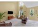 Spacious living room featuring vaulted ceilings, bright windows and comfortable seating arrangements at 16524 Kettlewell Ln, Charlotte, NC 28277