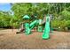 Community playground area with multiple slides, swings, and play structures at 16524 Kettlewell Ln, Charlotte, NC 28277