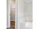 Bathroom with a large tub and an open door to a walk-in closet with metal racks at 1676 Starmount Cir, Lancaster, SC 29720