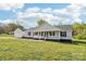 Inviting home with a covered front porch, black shutters, and manicured landscaping at 1676 Starmount Cir, Lancaster, SC 29720