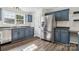Updated kitchen featuring stainless steel appliances and custom blue cabinets at 1676 Starmount Cir, Lancaster, SC 29720