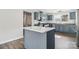 Modern kitchen features a marble countertop island, stainless appliances, and blue cabinets at 1676 Starmount Cir, Lancaster, SC 29720